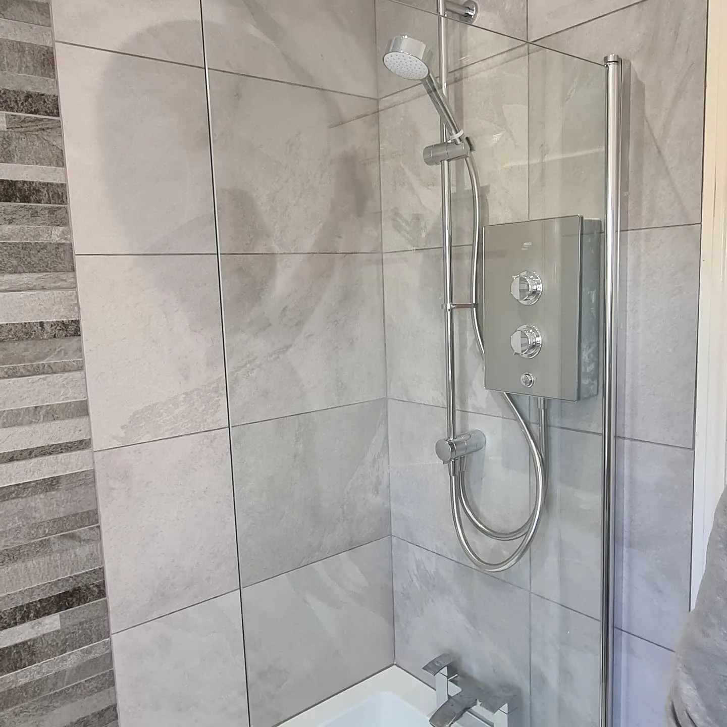Tiled shower enclosure with chrome shower fitted in Lancashire